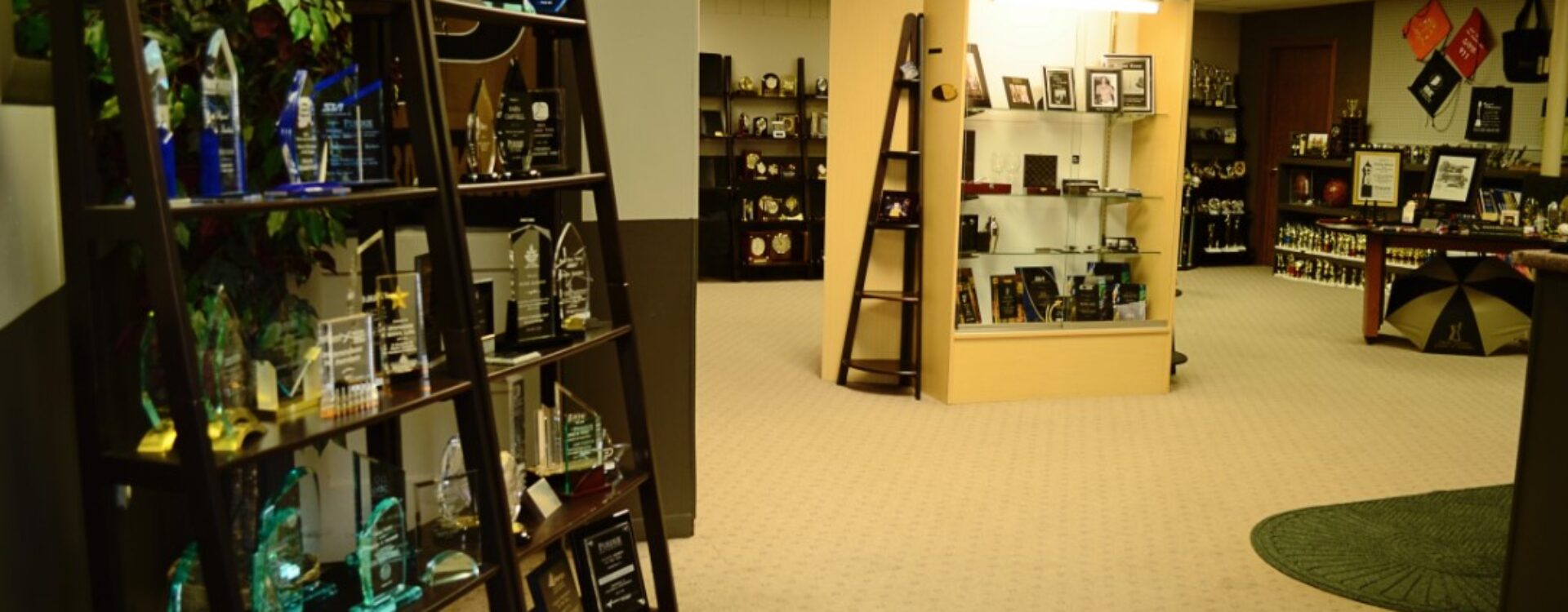 Awards Unlimited Showroom with shelves of sample awards on display