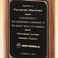 Main Image of Solid American walnut plaque with a precision elliptical edge and a black or brushed brass plate with printed border.