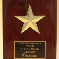 Main Image of Star casting with gabled points Goldtone finish on rosewood piano-finish plaque