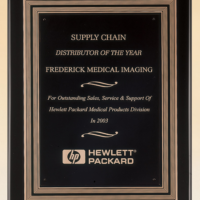 Main Image of Black stained piano finish plaque with a black and gold embossed back plate and black brass engraving plate.