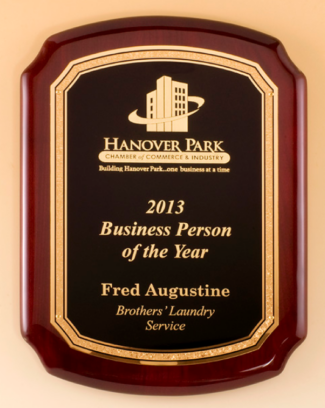Main Image of Rosewood piano-finish plaque featuring a gold florentine border with textured black center engraving plate.