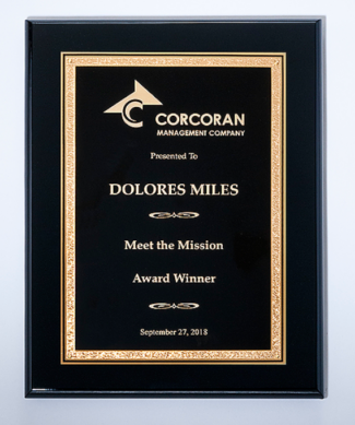 Airflyte black High Lustr plaque featuring a black and gold florentine engraving plate