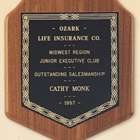 Main Image of American walnut plaque with a black brass plate.