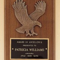 Main Image of American walnut plaque with a sculptured relief eagle casting